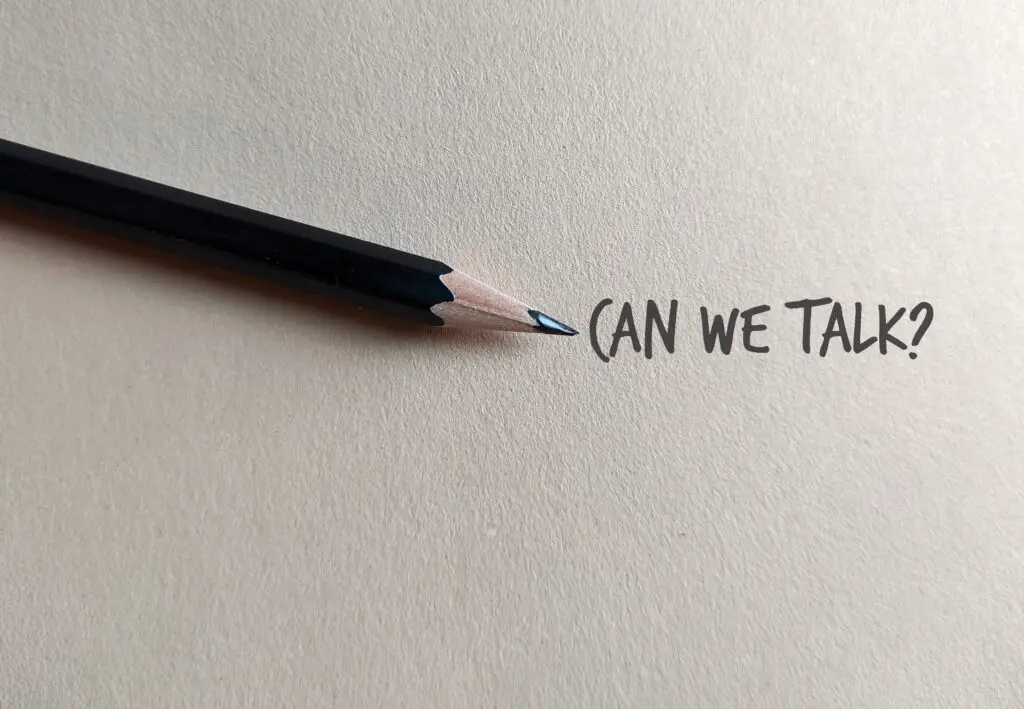 Pencil on copy space craft paper with text written CAN WE TALK?, concept of boss , manager, partners or friends approach to have a serious talk or difficult conversation to solve conflicts or relation